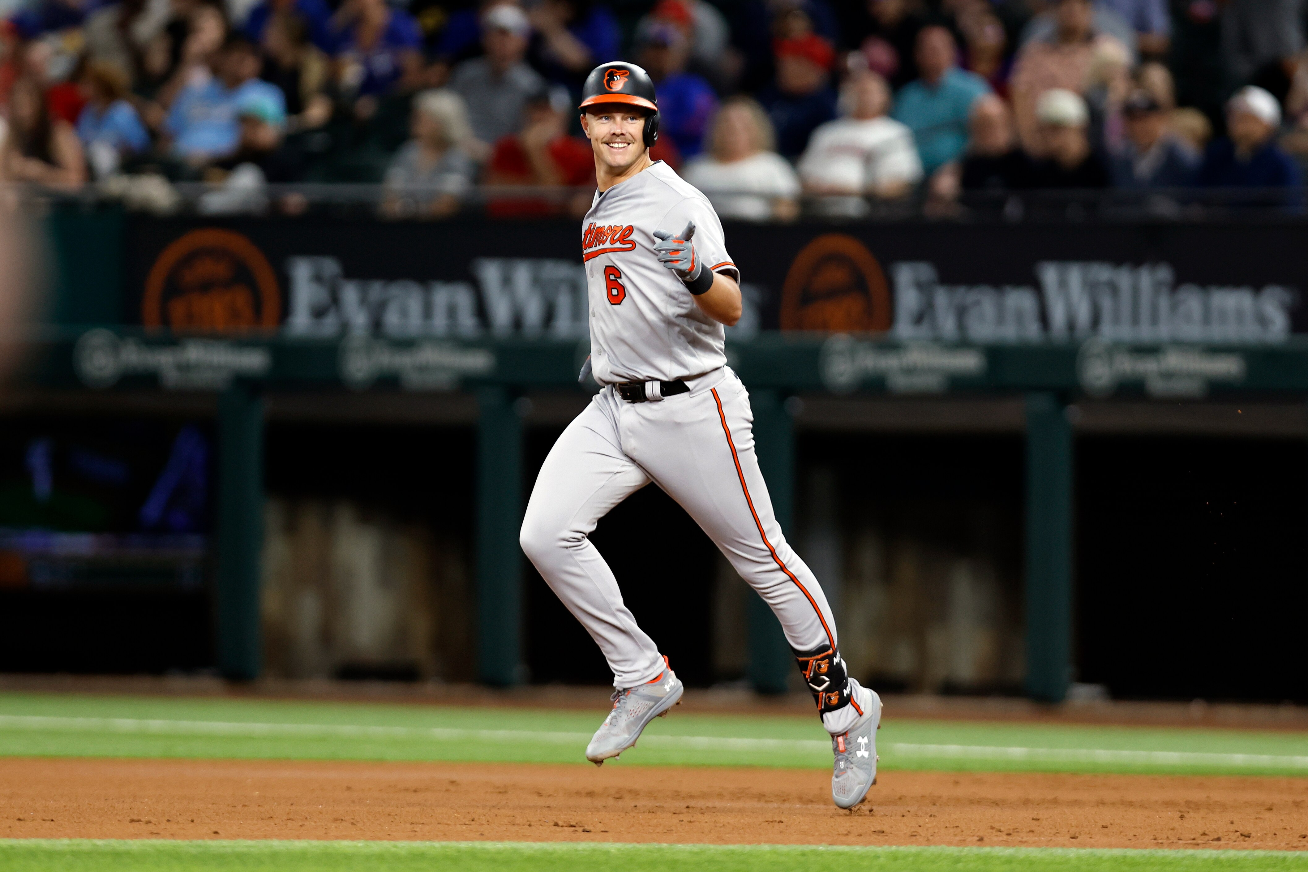 ARLINGTON, TEXAS - APRIL 04: Ryan Mountcastle #6 of the Baltimore Orioles rounds the bases after hitting a three run home run in the second inning against the Texas Rangers at Globe Life Field on April 04, 2023 in Arlington, Texas.