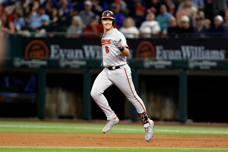 ARLINGTON, TEXAS - APRIL 04: Ryan Mountcastle #6 of the Baltimore Orioles rounds the bases after hitting a three run home run in the second inning against the Texas Rangers at Globe Life Field on April 04, 2023 in Arlington, Texas.