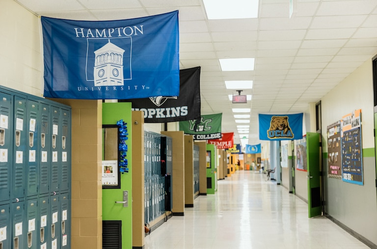 The school hallway showing classrooms decorated with university themes in KIPP Harmony Academy is seen on December 5, 2024.