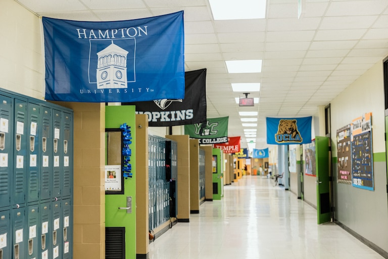 The school hallway showing classrooms decorated with university themes in KIPP Harmony Academy is seen on December 5, 2024.