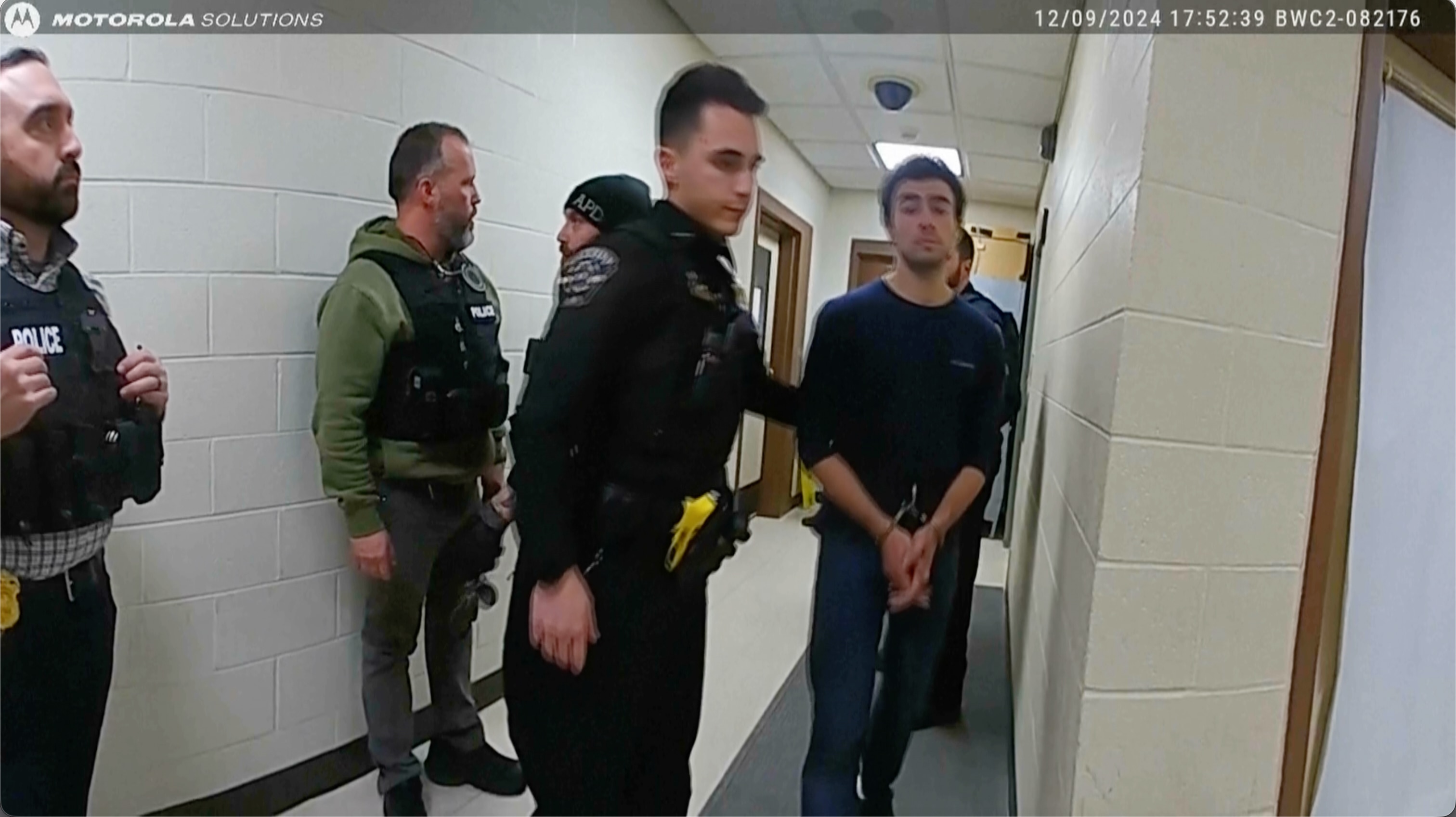 This image, provided by the Altoona Police Department, shows body camera footage of police officers arresting Luigi Mangione in Altoona, Pa., on Dec. 9, 2024. (Altoona Police Department via AP)