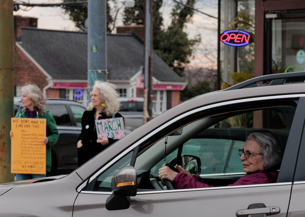 Senior activists meet up every Wednesday on the corner of 40th Street and Roland Avenue in Hampden to protest actions of the Trump administration.