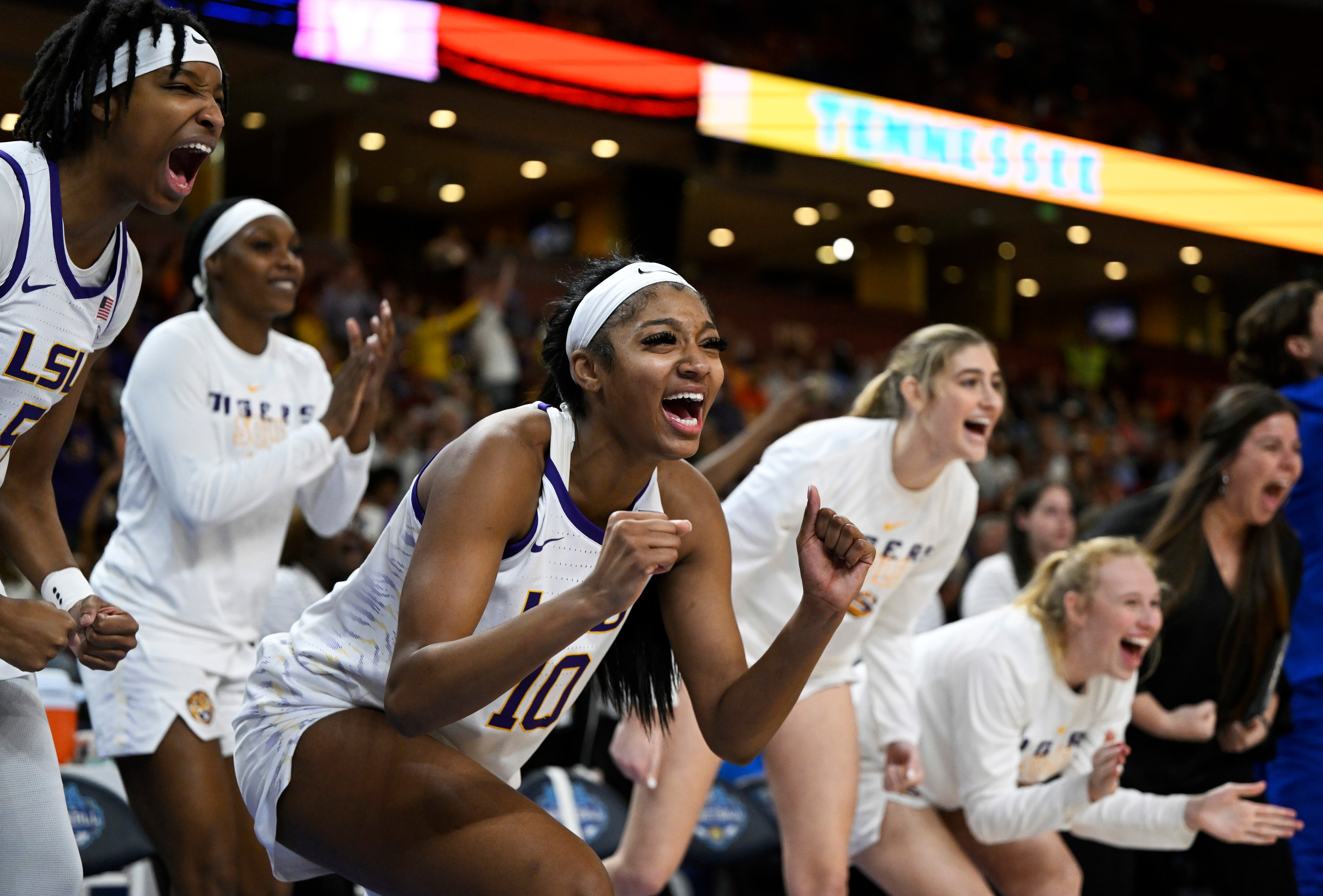 GREENVILLE, SOUTH CAROLINA - MARCH 04: Angel Reese #10 of the LSU Lady Tigers cheers from the bench with her team against the Tennessee Lady Vols in the second quarter during the semifinals of the SEC Women's Basketball Tournament at Bon Secours Wellness Arena on March 04, 2023 in Greenville, South Carolina.