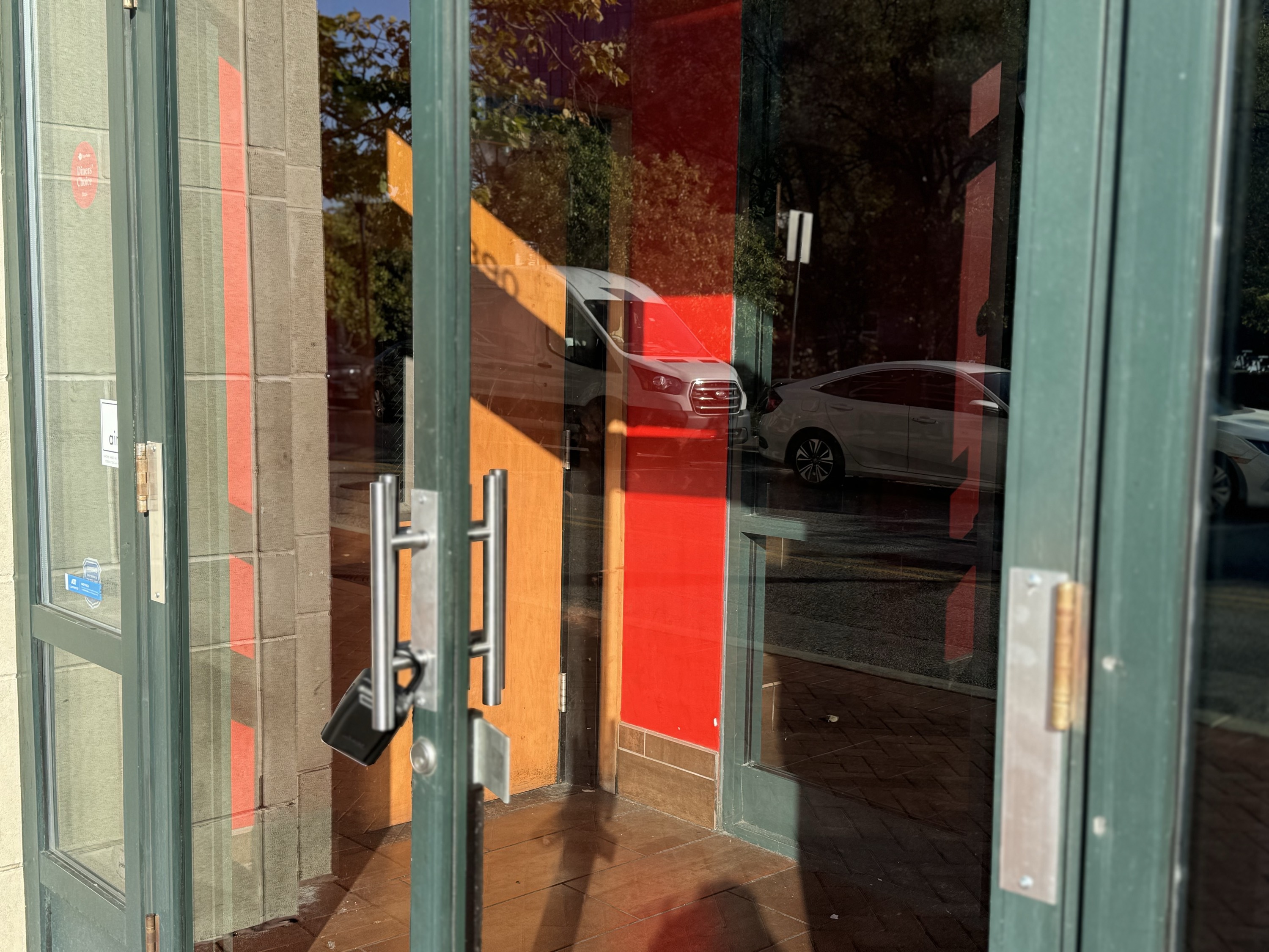All signage has been removed from RA Sushi Bar Restaurant, which now has a lock on its front door.