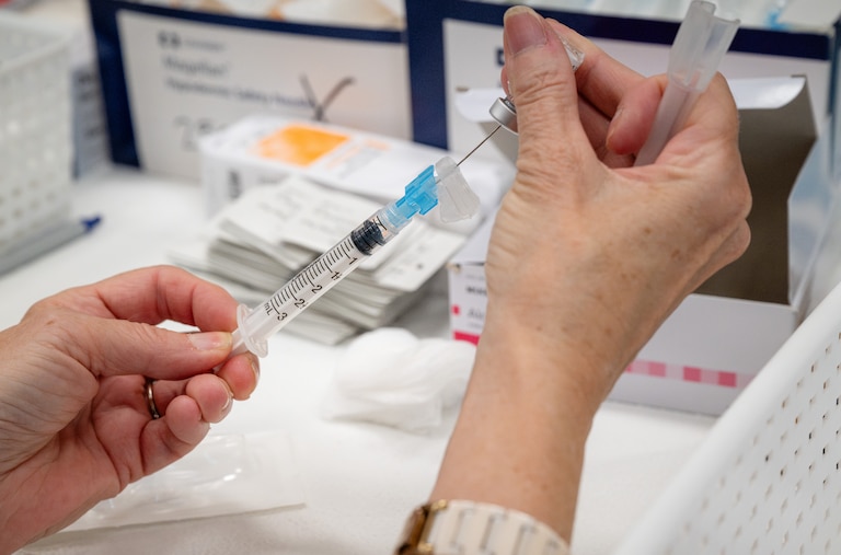Vaccine Clinic staff prepare syringes during BCPS Fest held at New Town High School on August 16th, 2025 in Owings Mills, MD.