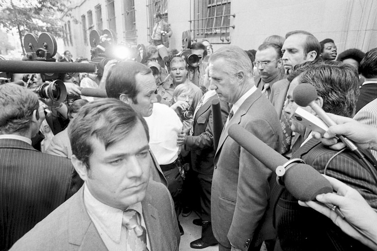 FILE - Spiro T. Agnew, who recently resigned from the vice presidency, talks a member of the media after he pleaded no contest to a federal tax evasion charge, outside the Federal Court building in Baltimore, Oct. 10, 1973. The last time Secret Service agents delivered a U.S. leader to face criminal charges, they kept their mission a secret, even from their own bosses. It was Oct. 10, 1973, and just a few agents knew the historic role they were playing in ensuring that Agnew appeared in a federal courtroom to enter a plea and resign from office.