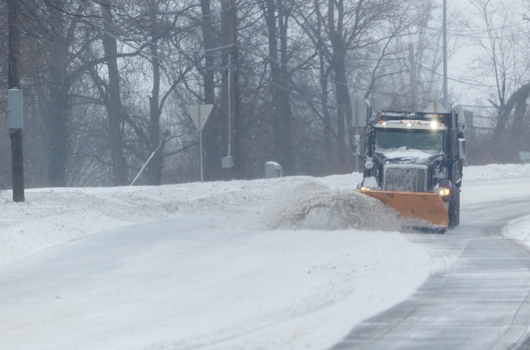 A snowplow travels south on Colesville Road on Sunday, Jan. 25, 2026, during a snowstorm in Silver Spring, Md.