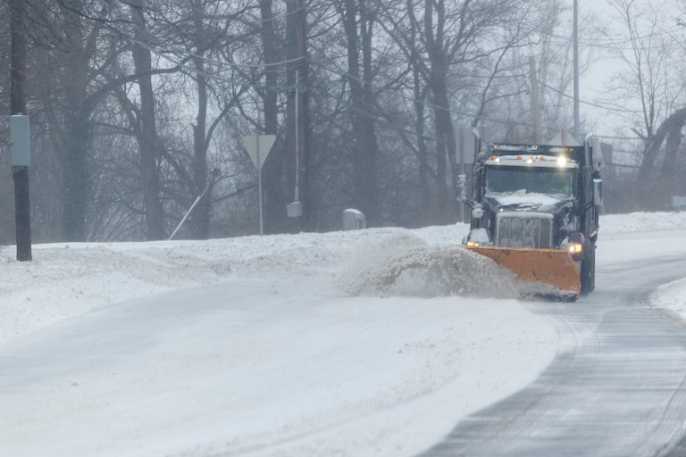 A snowplow travels south on Colesville Road on Sunday, Jan. 25, 2026, during a snowstorm in Silver Spring, Md.