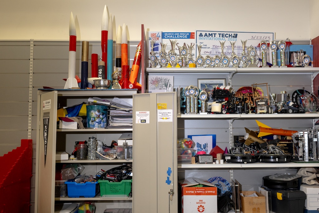 Rockets and trophies won by student teams are displayed atop a cabinet of engineering parts at the Rockville Science Center. The Rockville Science Center announced it will have to move from its current location and is asking the community to help raise funds for a permanent home. The center connects K-12 students to on-site STEM programs including robotics and drone engineering, for which students have taken top honors in national competitions.