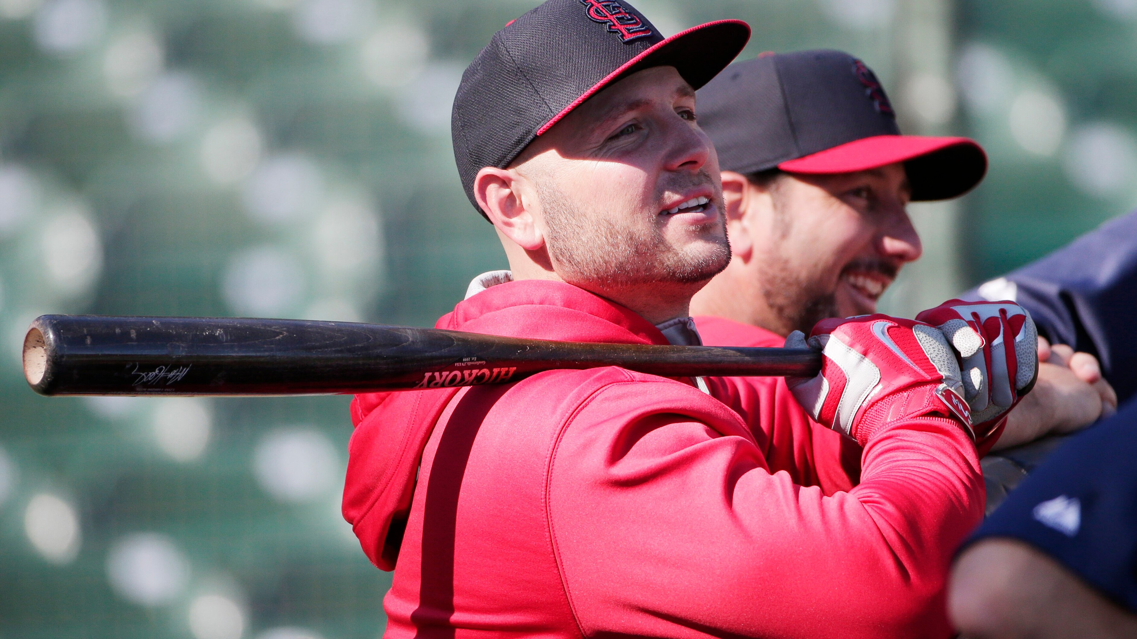 St. Louis Cardinals' Matt Holliday, left, smiles alongside hitting coach John Mabry during a team workout on Monday, Oct. 13, 2014, in San Francisco.  The St. Louis Cardinals and San Francisco Giants are scheduled to play Game 3 of the National League Championship Series on Tuesday in San Francisco. (AP Photo/Marcio Jose Sanchez)