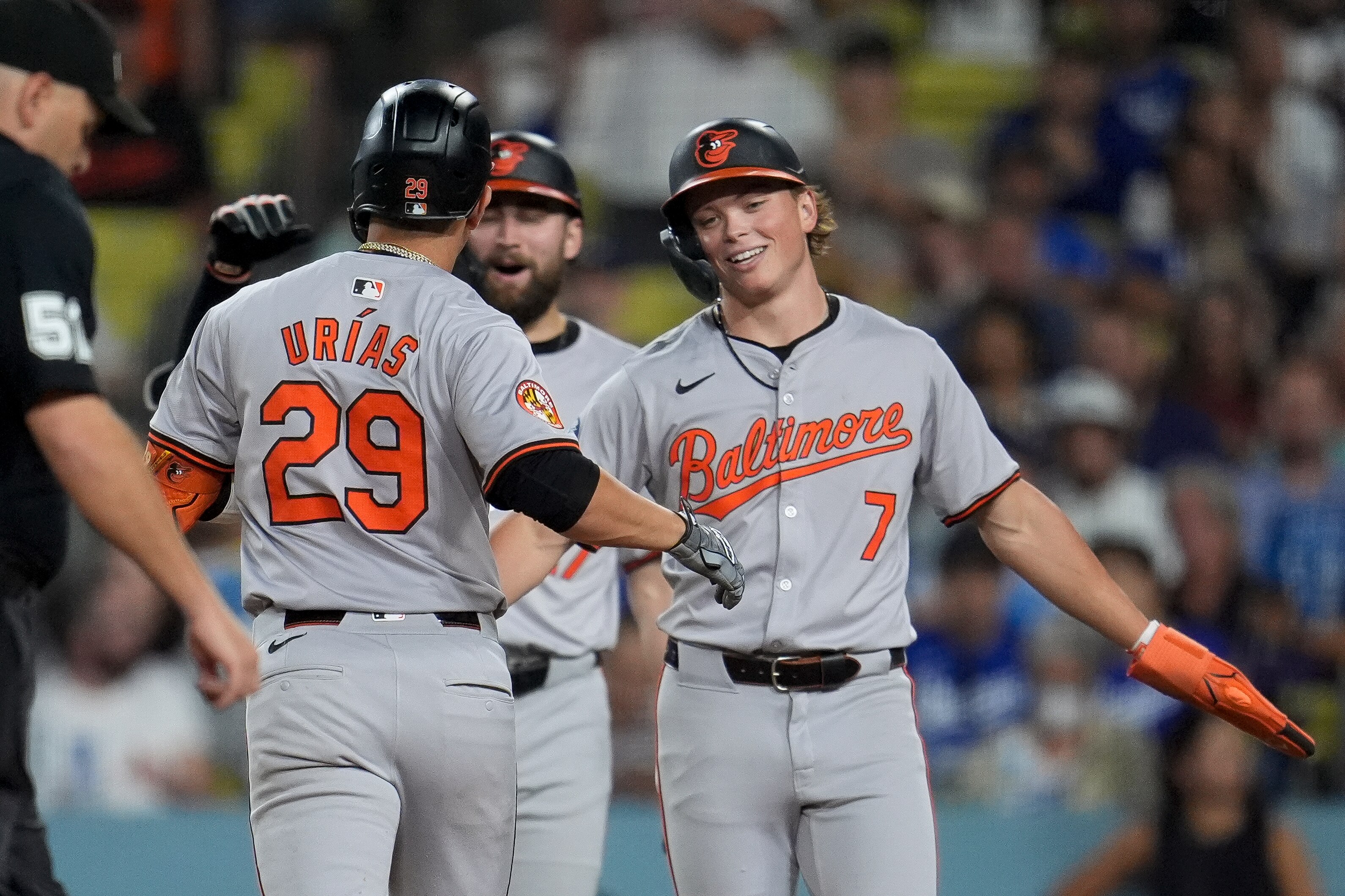 Baltimore Orioles' Ramón Urías (29) celebrates his two-run home run with Jackson Holliday (7) during the fifth inning of a baseball game against the Los Angeles Dodgers, Tuesday, Aug. 27, 2024, in Los Angeles. (AP Photo/Marcio Jose Sanchez)
