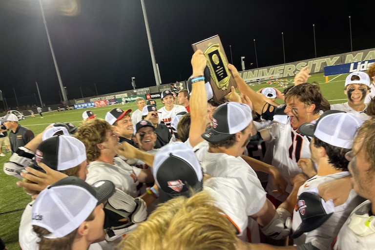 McDonogh lacrosse team holds up the MIAA A Conference championship plaque Friday evening. The No. 1 Eagles defeated second-ranked Calvert Hall for their second straight title and third since 2016.