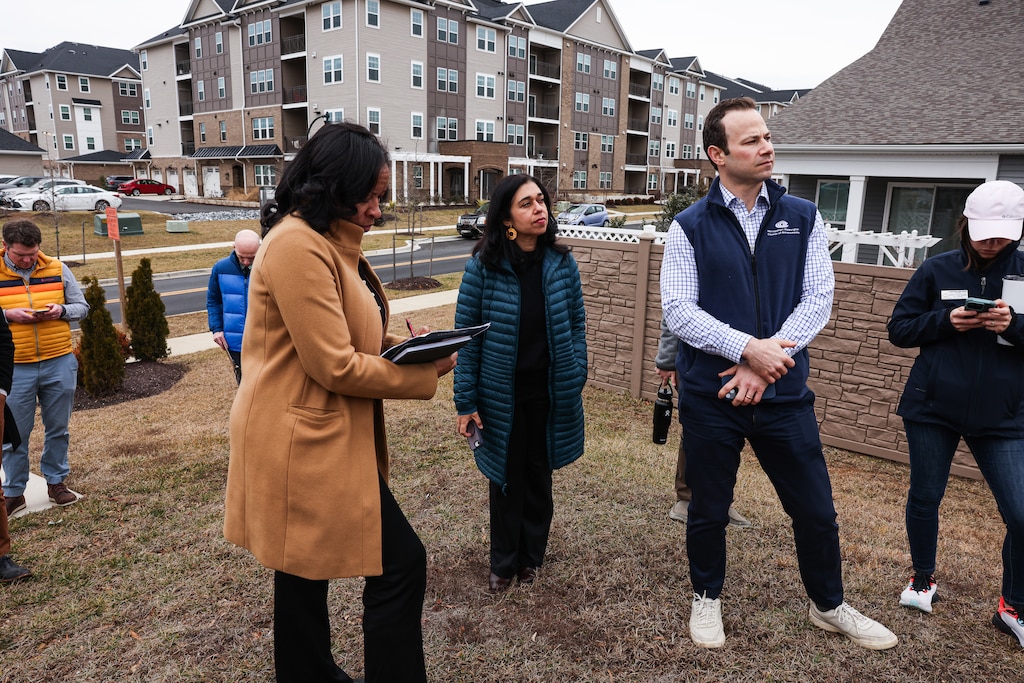 Montgomery County Council At-Large Member Shebra Evans, President Natali Fani-González, member Andrew Friedson, and staff from the Montgomery County Planning Department participate in a bus tour of the Clarksburg Gateway Sector Plan led by Montgomery Planning in Clarksburg, MD. Here, the tour stops at Cabin Branch Parkway.