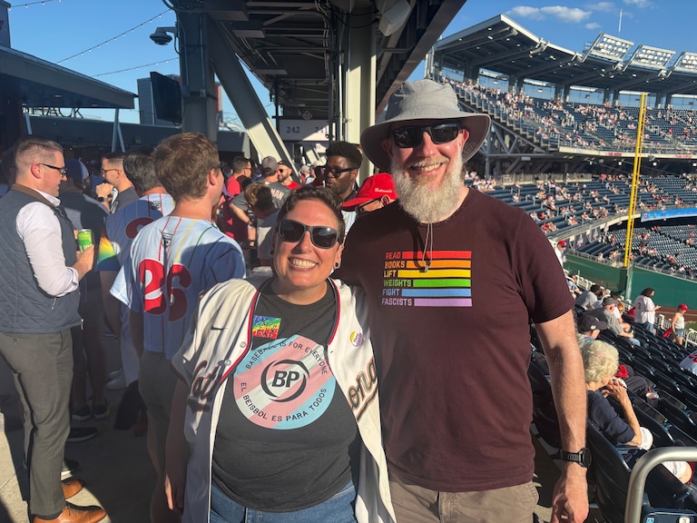 Jenn Rubinstein, 44, and James Hamblin, 50, smile at the Nationals’ 21st pride night.