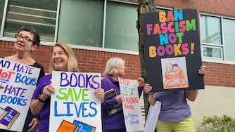 AUGUST 18, 2025 - Dozens of protesters stand outside the Harford County Public Schools headquarters to protest the school board's decision to ban a book from school libraries.