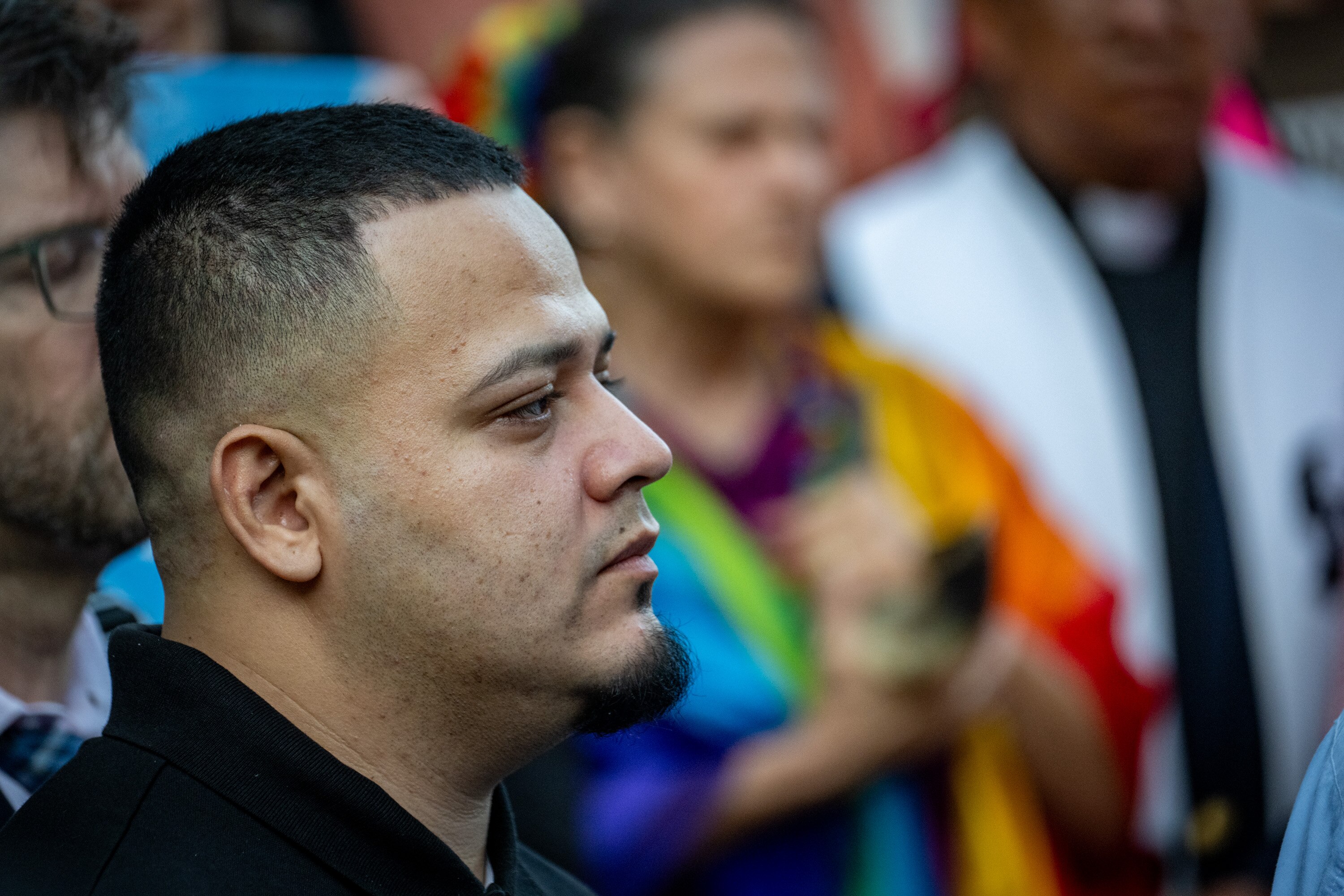 Kilmar Abrego Garcia listens to speakers at a rally on his behalf in downtown Baltimore early Monday.