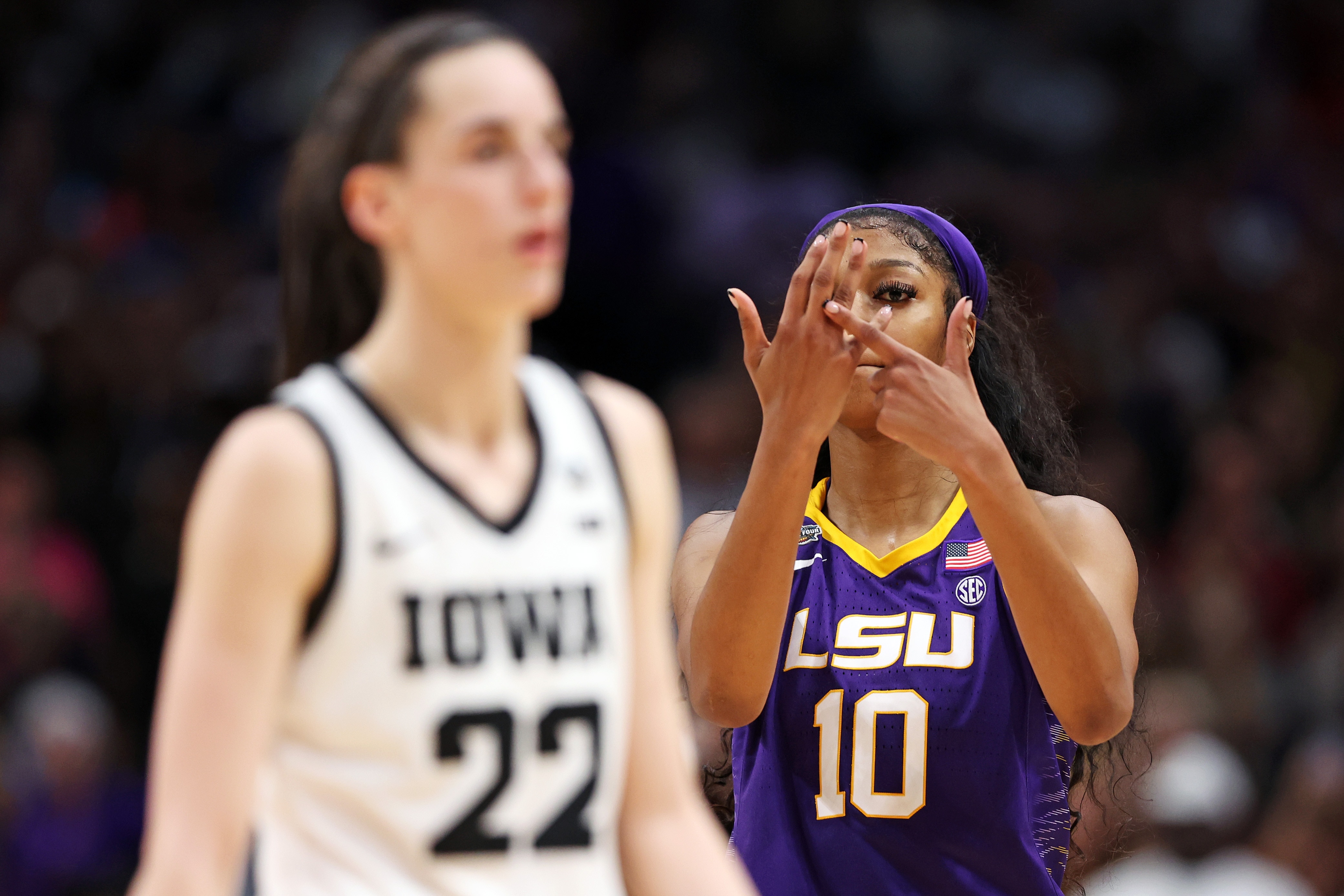 DALLAS, TEXAS - APRIL 02: Angel Reese #10 of the LSU Lady Tigers reacts towards Caitlin Clark #22 of the Iowa Hawkeyes during the fourth quarter during the 2023 NCAA Women's Basketball Tournament championship game at American Airlines Center on April 02, 2023 in Dallas, Texas. (Photo by Maddie Meyer/Getty Images)