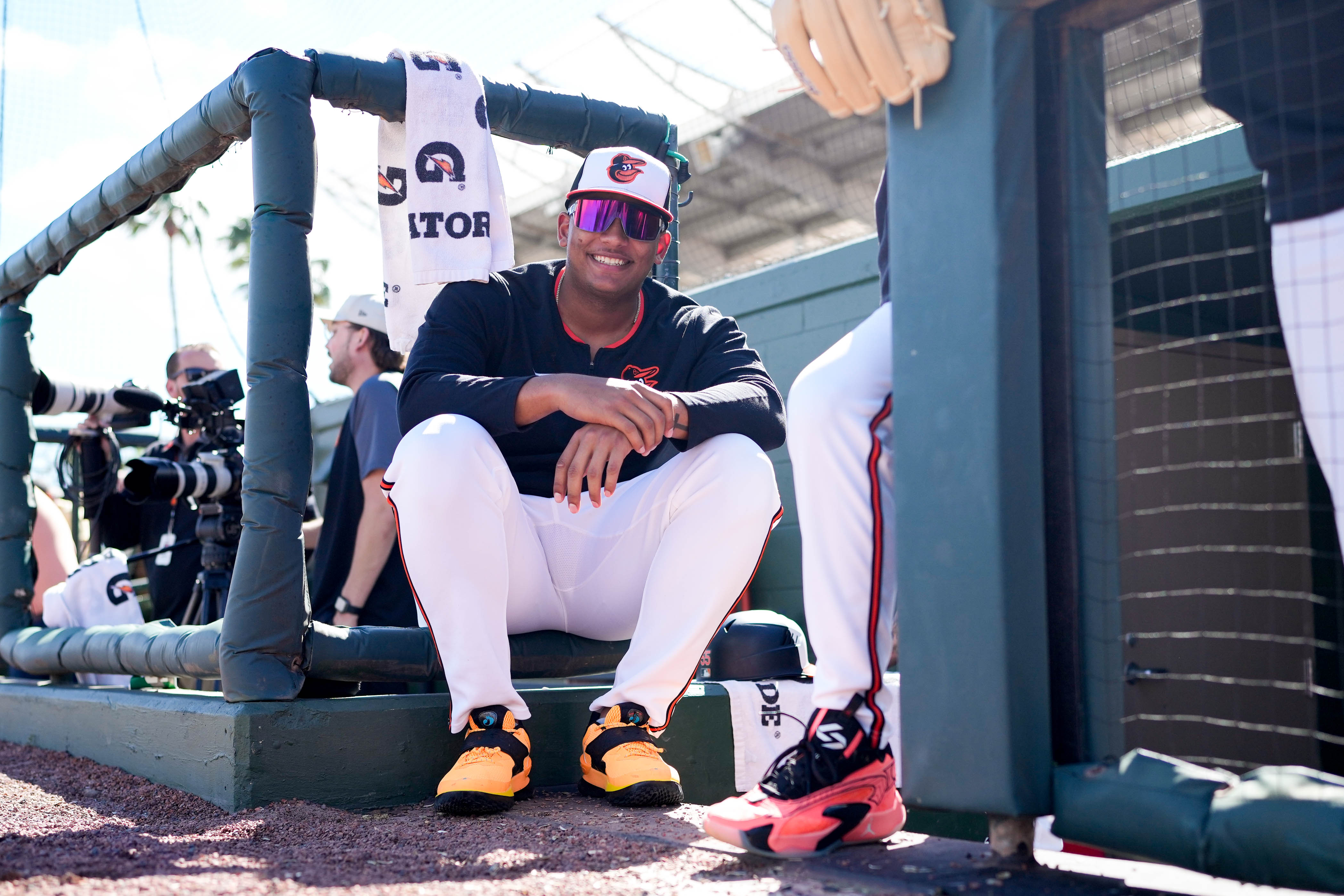 Catching prospect Samuel Basallo watches his teammates play a Grapefruit League game against the Detroit Tigers in February.