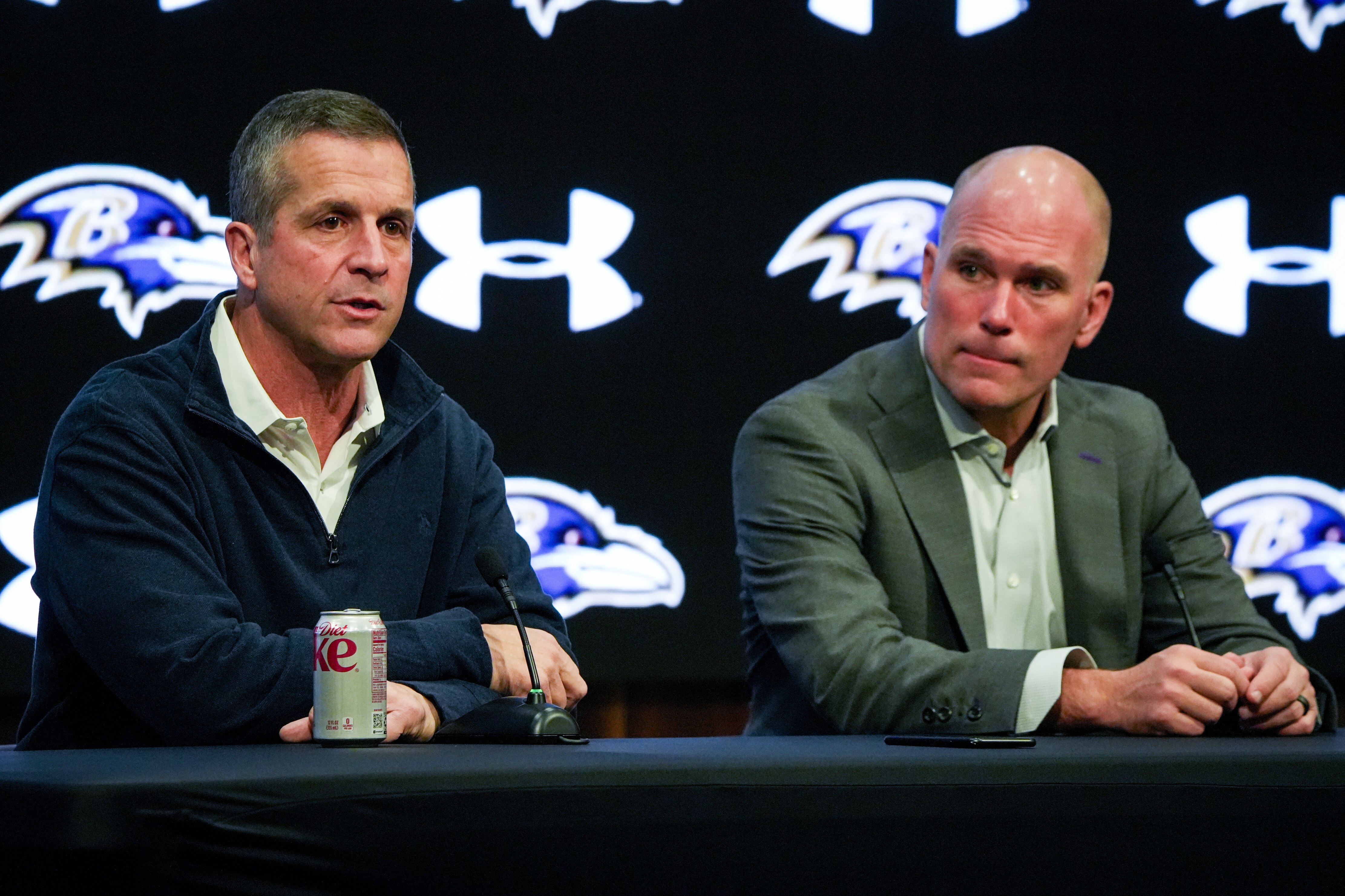 Ravens coach John Harbaugh, left, and general amnager Eric DeCosta take questions from reporters during the team’s end-of-year news conference. They met the media again Tuesday to discuss the NFL draft.