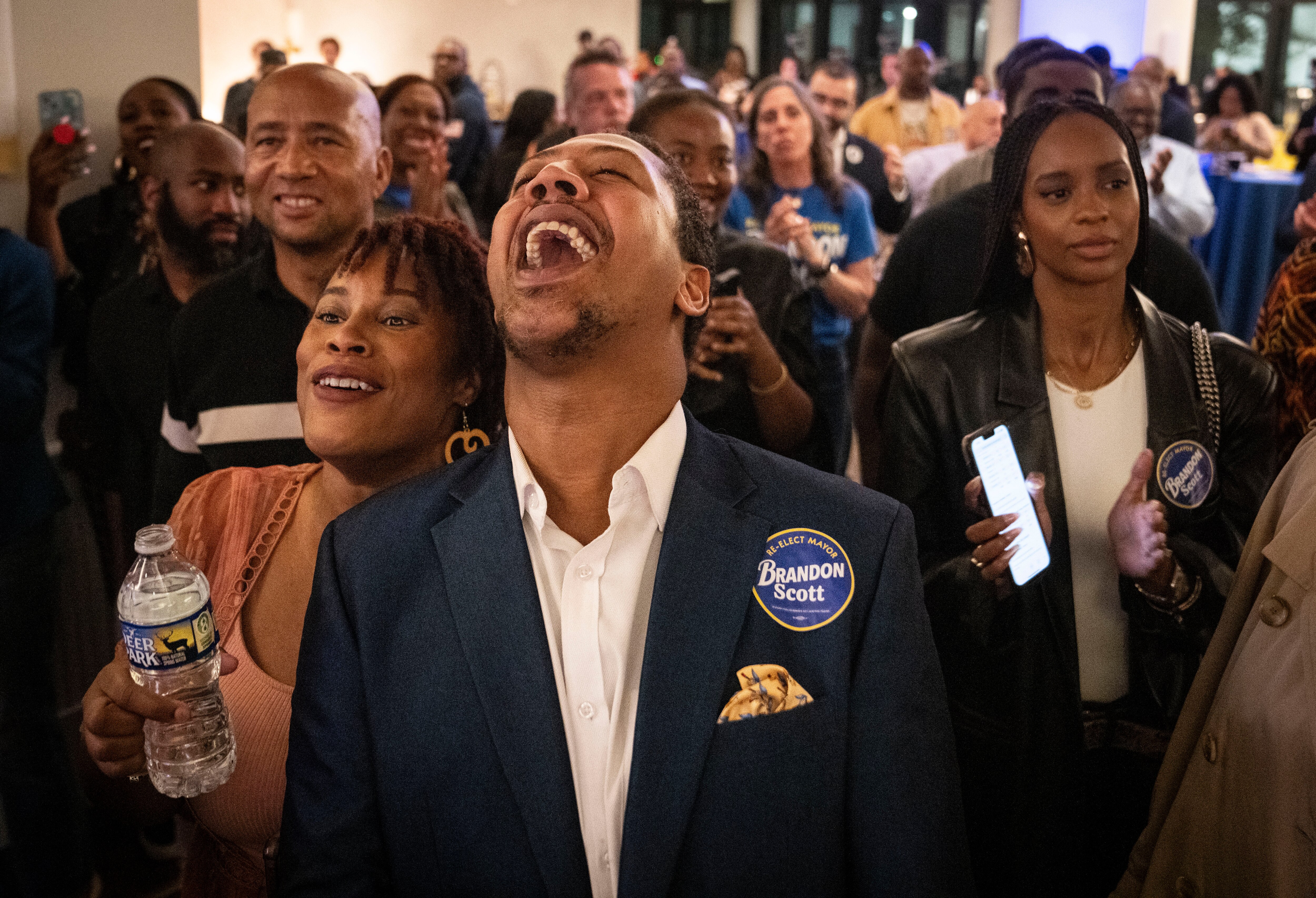 Tierra Taylor and James Lynch cheer as Baltimore Mayor Brandon Scott comes to the stage at Mayor Scott’s election night event and watch party.