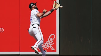 Baltimore Orioles left fielder Weston Wilson is unable to catch a two-run triple hit by Arizona Diamondbacks' Adrian del Castillo during the third inning.