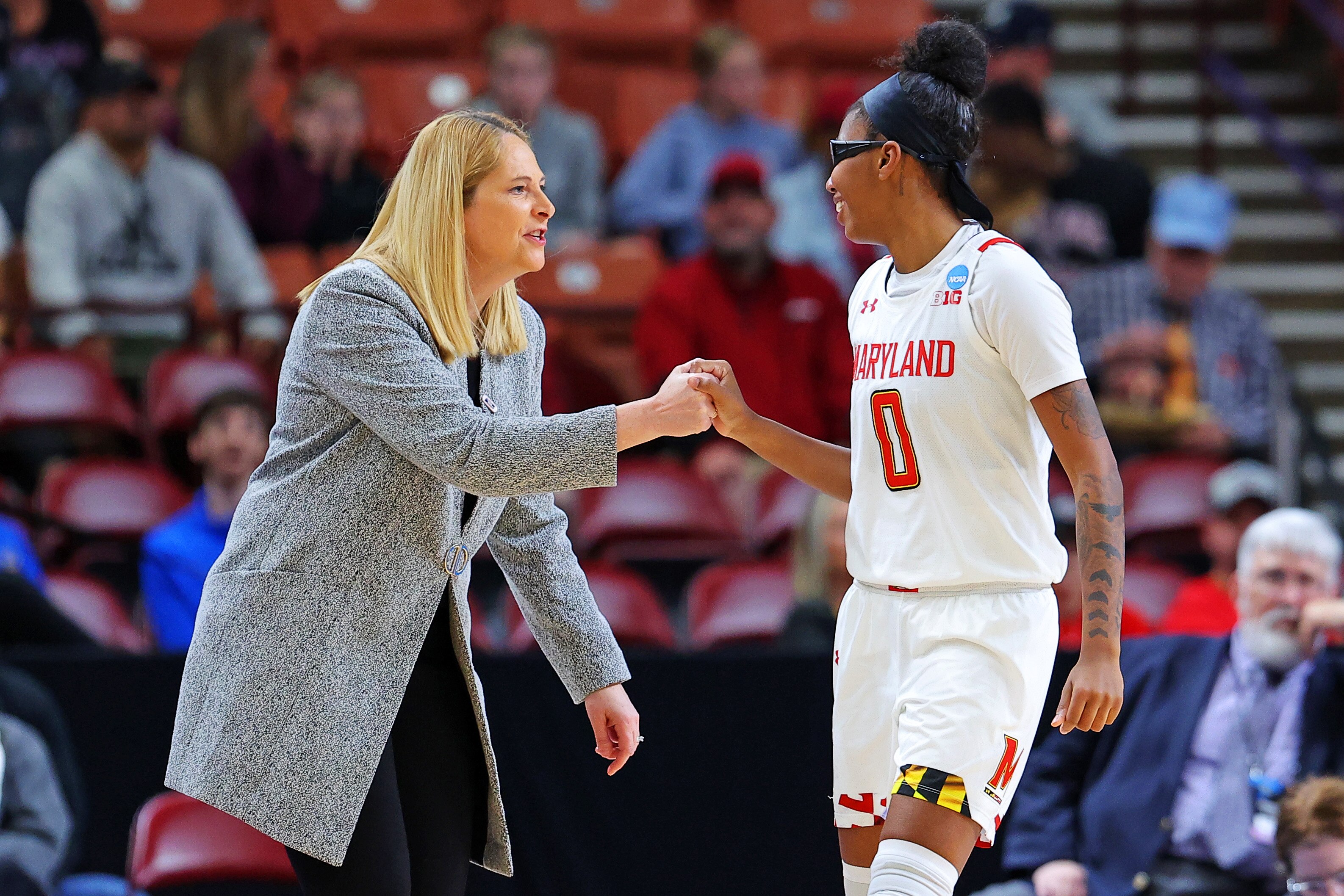 GREENVILLE, SOUTH CAROLINA - MARCH 25: Shyanne Sellers #0 of the Maryland Terrapins celebrates with head coach Brenda Frese of the Maryland Terrapins during the second half in the Sweet 16 round of the NCAA Women's Basketball Tournament at Bon Secours Wellness Arena on March 25, 2023 in Greenville, South Carolina. (Photo by Kevin C. Cox/Getty Images)