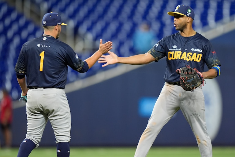 Curacao relief pitcher Anthony Herrera (1) and infielder Sharlon Schoop celebrate after Curacao beat Mexico, 6-5, during a Caribbean Series game in 2024.