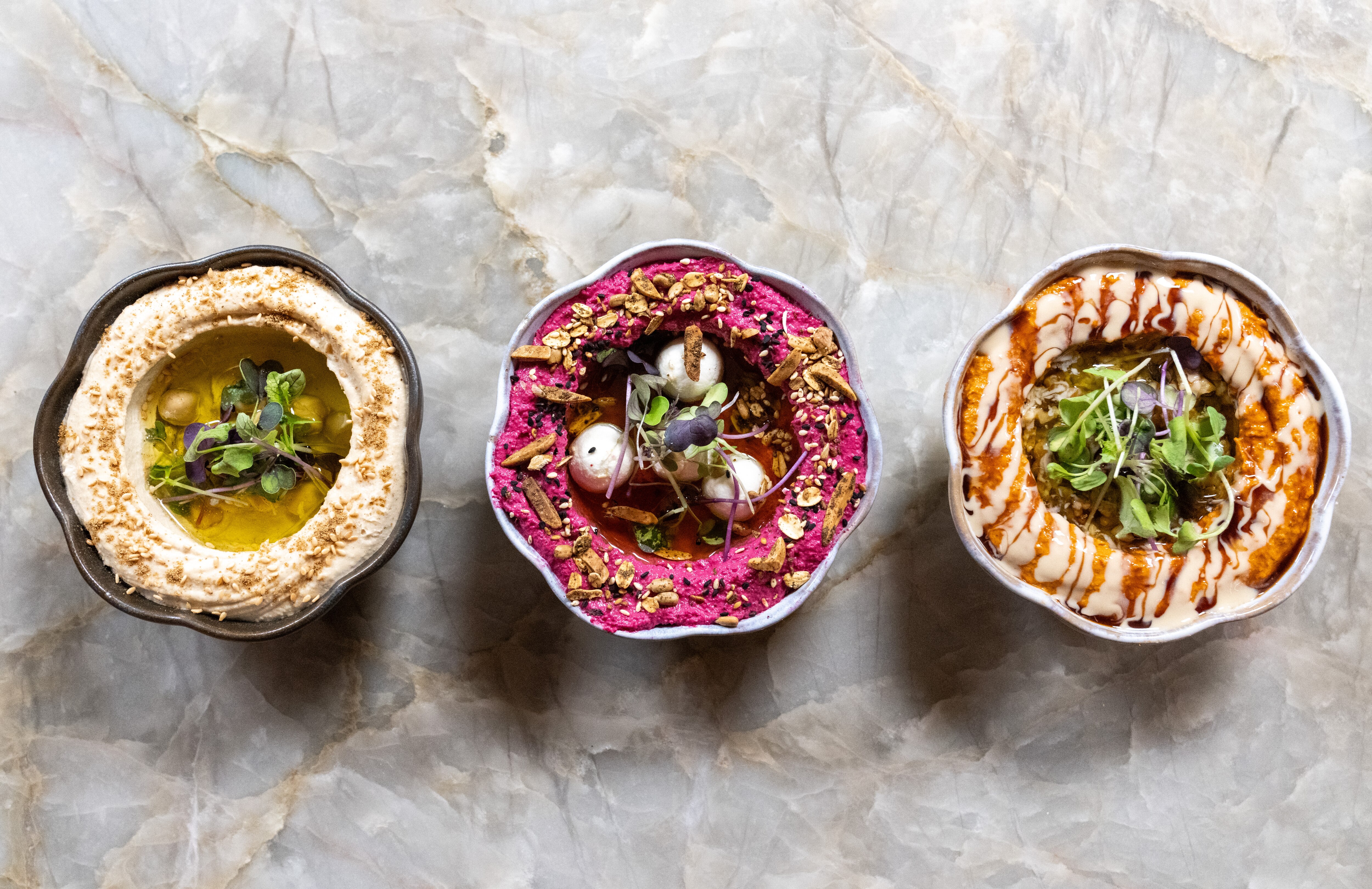 From left, hummus, beet mutabal and muhammara from Ammoora, which just made the New York Times' 2024 list of the best restaurants in the country.
