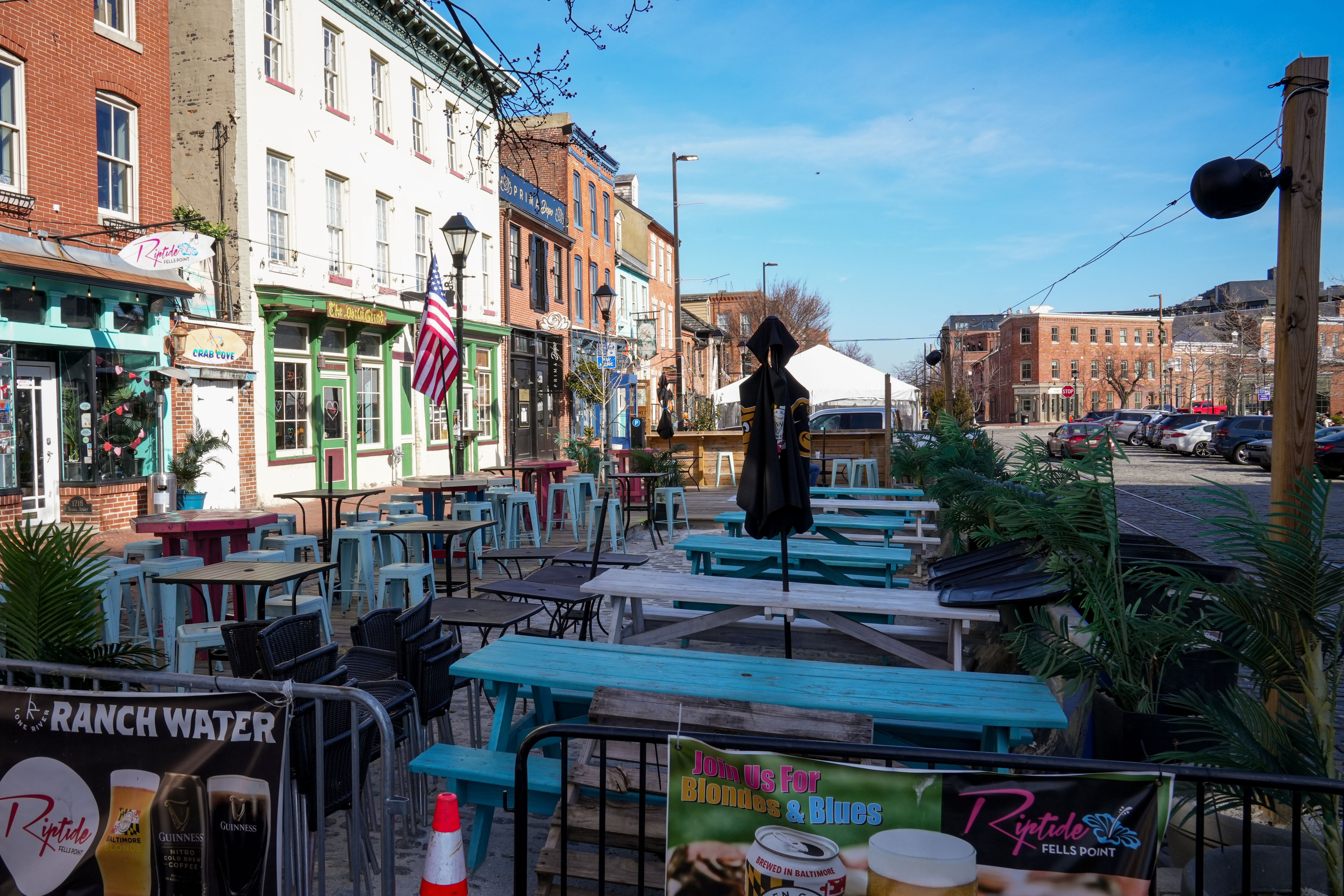Restaurants like Riptide along Fells Point’s waterfront have set up “parklets” for guests to enjoy outdoor dining.