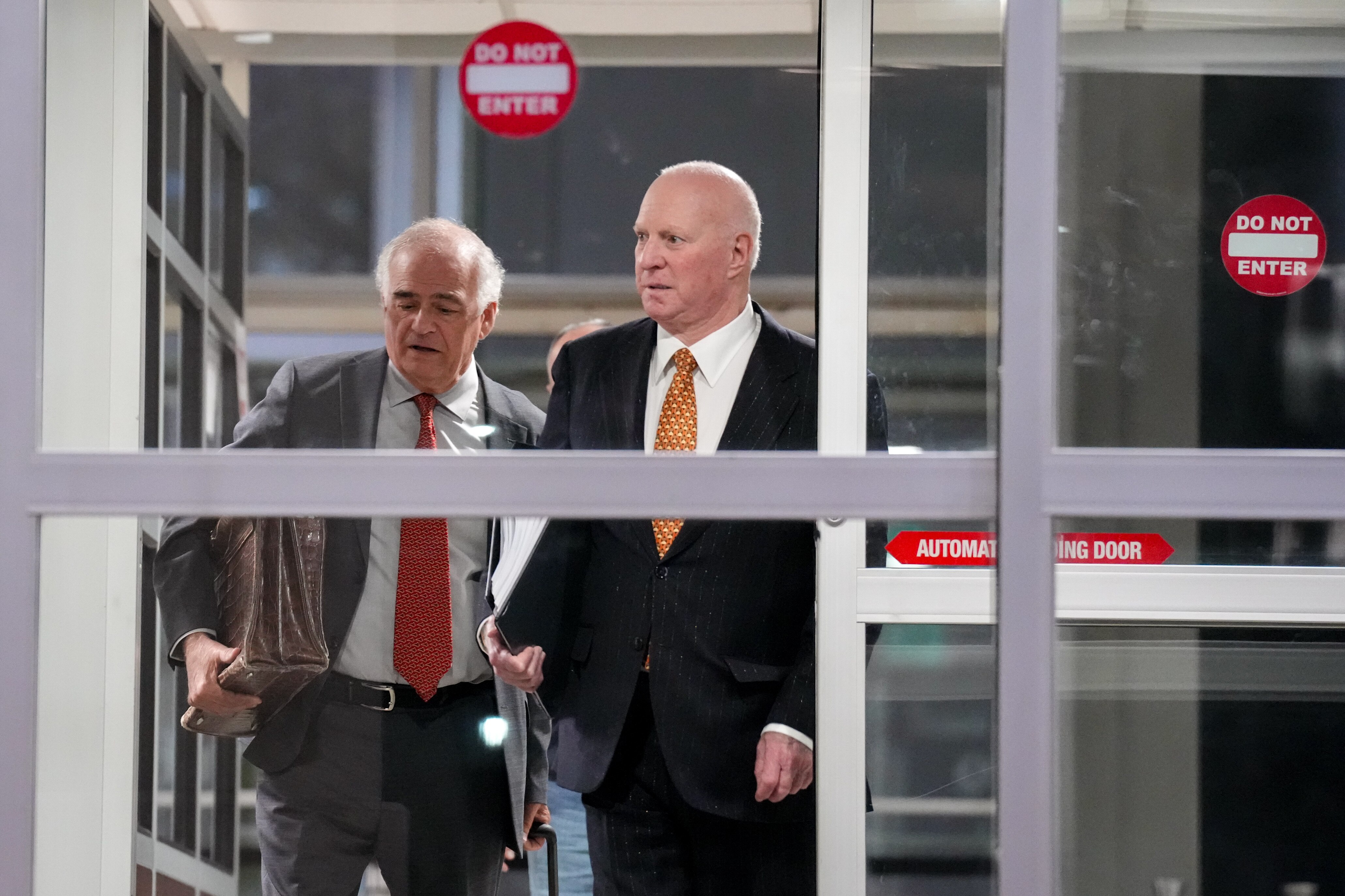 Attorney Stephen L. Snyder, right, leaves the courthouse with Gerald Ruter, his standby defense counsel, last week. One of Snyder’s former associates on Monday testified that he was directed to destroy evidence.