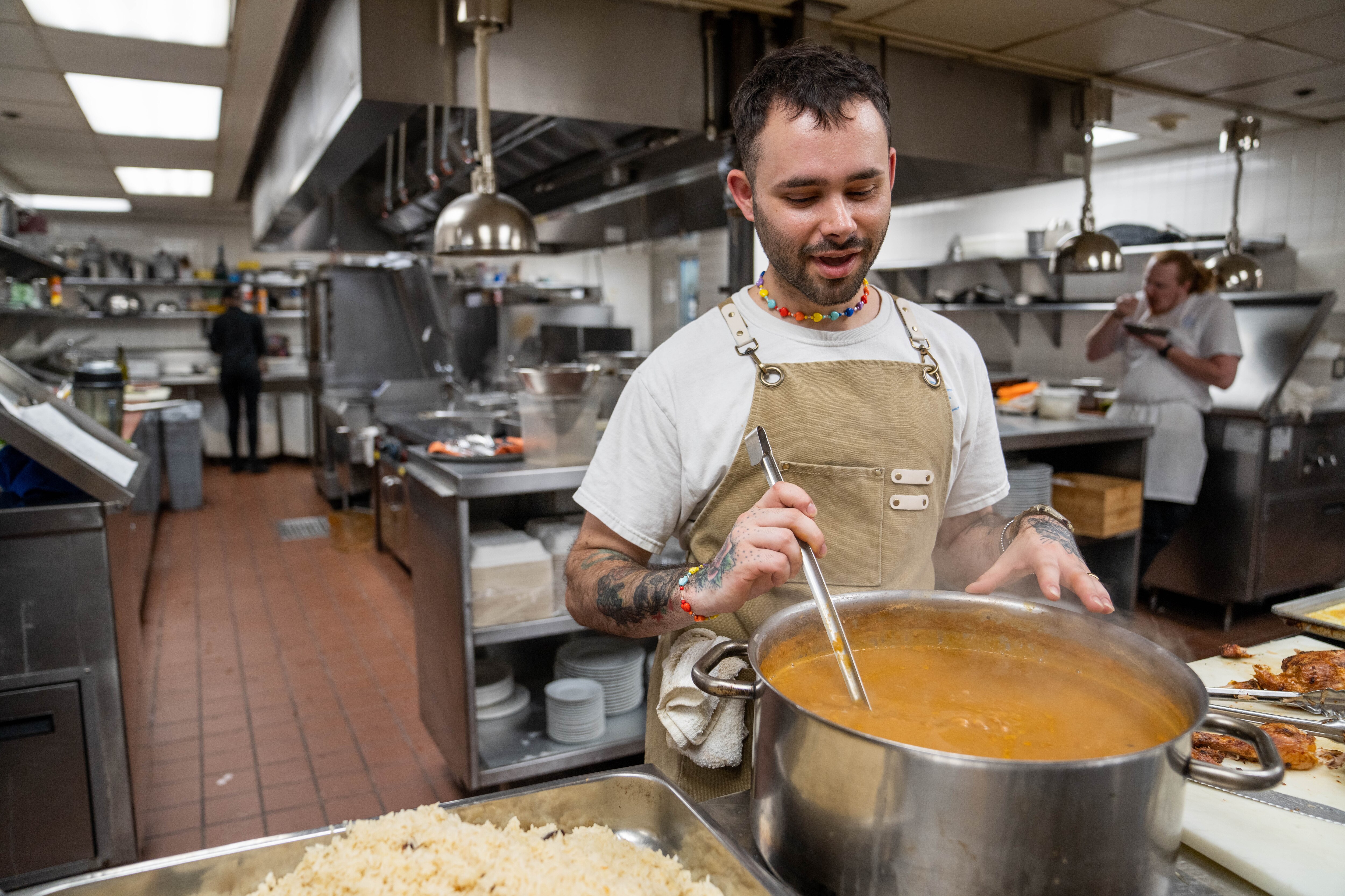 Cinghiale Sous chef Juan David Culeta preparing latin-themed family meal