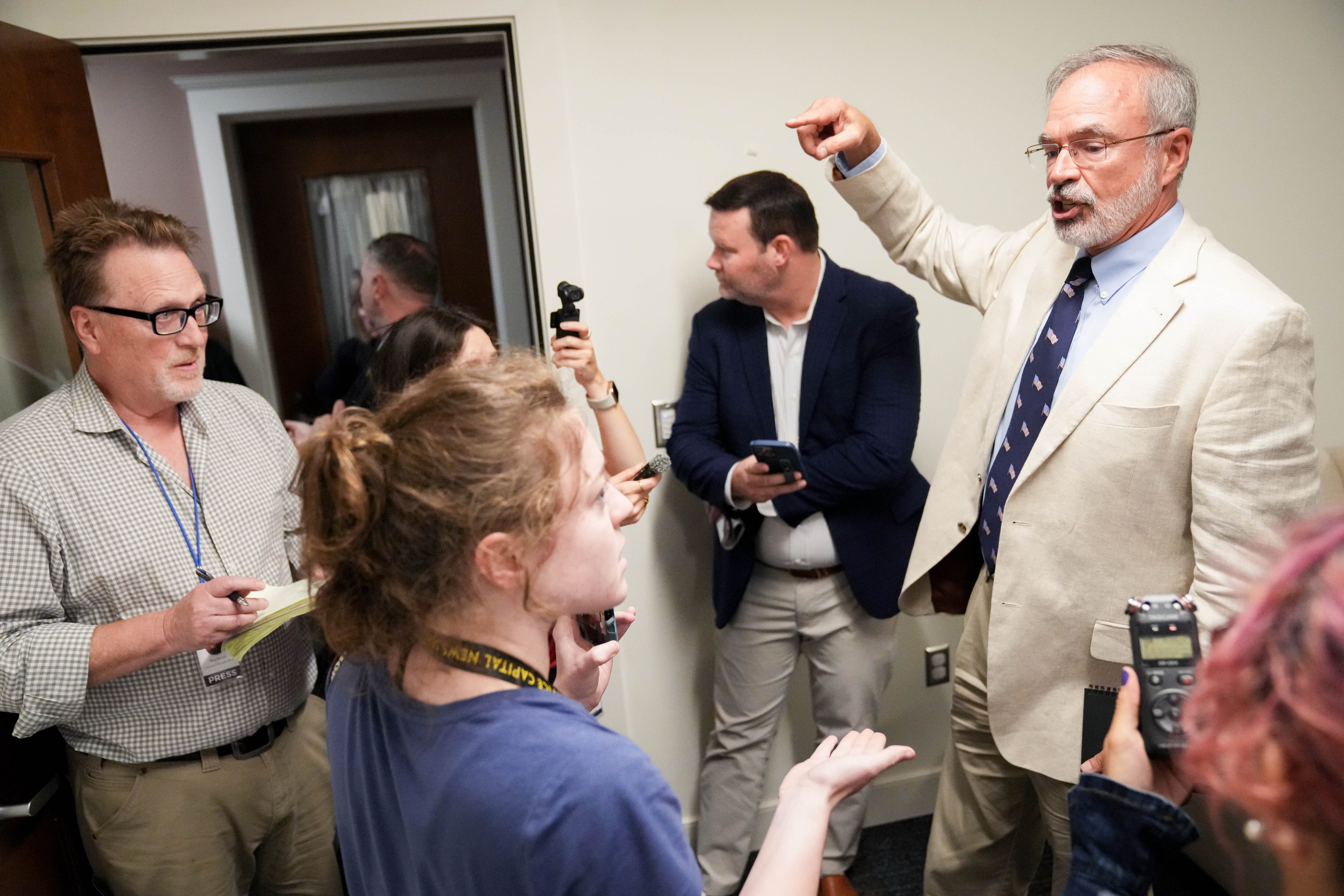 U.S. Rep. Andy Harris refuses to take questions from Cat Murphy, a Capital News Service reporter from the University of Maryland, and attempts to remove her from a press gaggle following a League of Women Voters forum at the Chesapeake Grove Intergenerational Center in Cambridge on Tuesday.