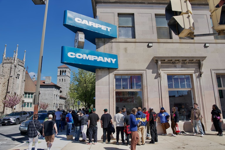 SATURDAY, APRIL 11, 2026 - Hundreds of people from all over wait in line to be the first people to enter Carpet Company’s flagship store on North Avenue.