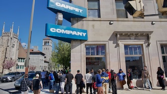 SATURDAY, APRIL 11, 2026 - Hundreds of people from all over wait in line to be the first people to enter Carpet Company’s flagship store on North Avenue.