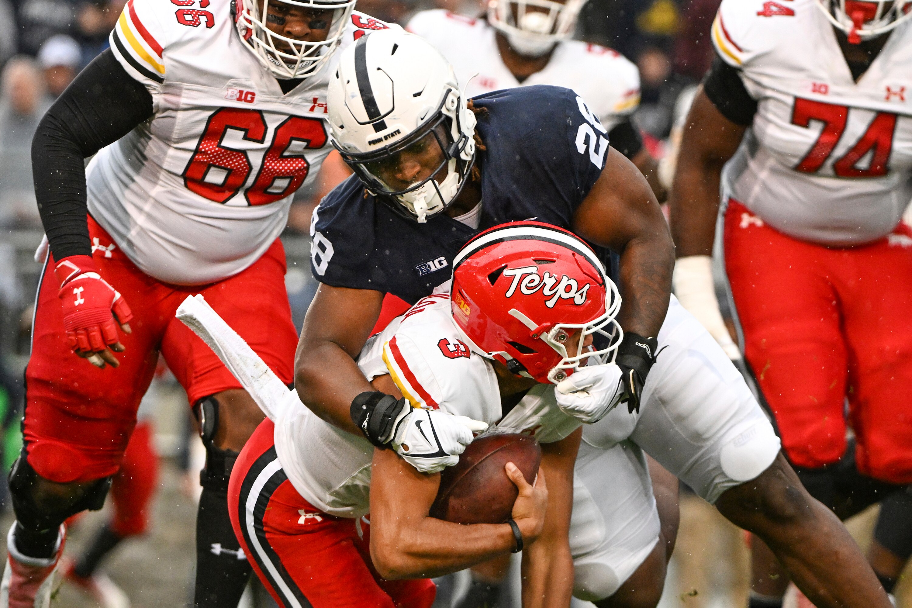 Penn State defensive tackle Zane Durant sacks Maryland quarterback Taulia Tagovailoa (3) during the first half of an NCAA college football game, Saturday, Nov. 12, 2022, in State College, Pa.
