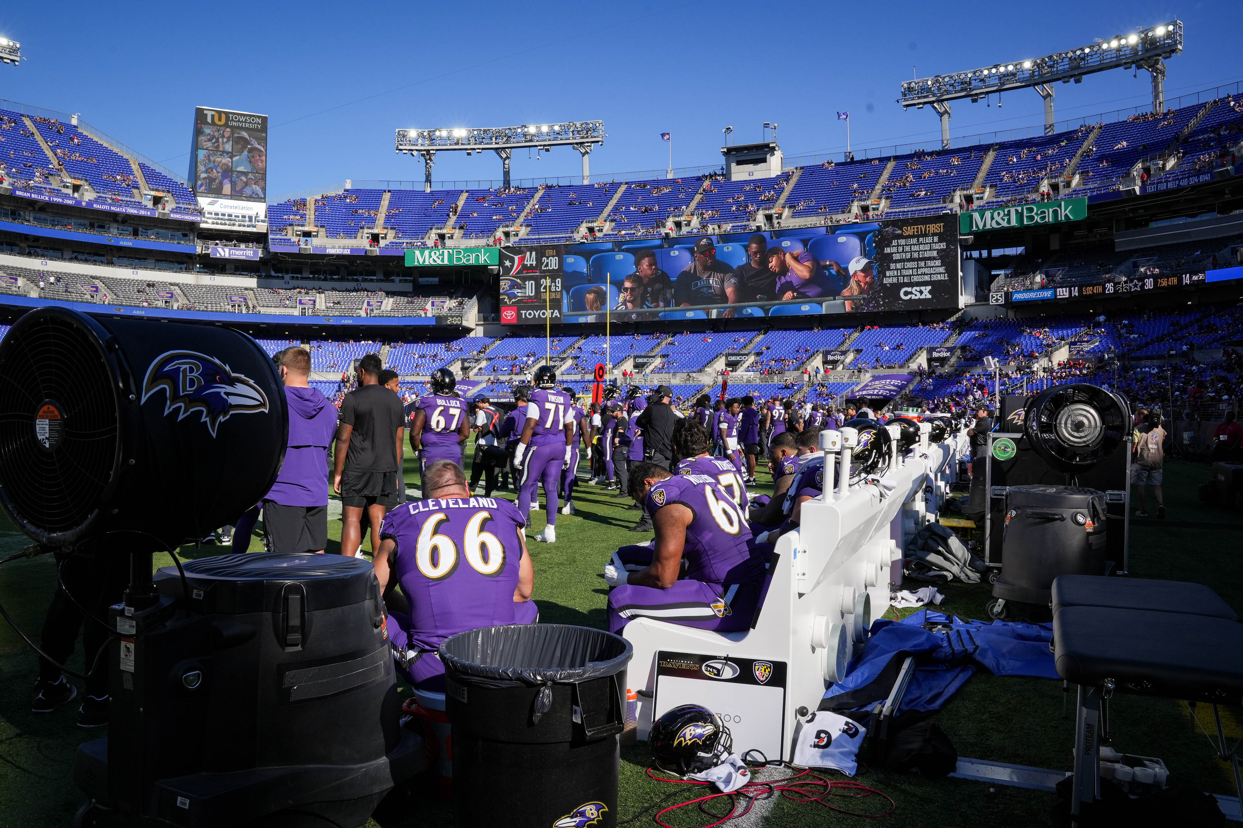 Baltimore Ravens players sit on the bench, while many fans have already left early in the fourth quarter of a game against the Houston Texans at M&T Bank Stadium in Baltimore, Md., on Sunday, Oct. 5, 2025.