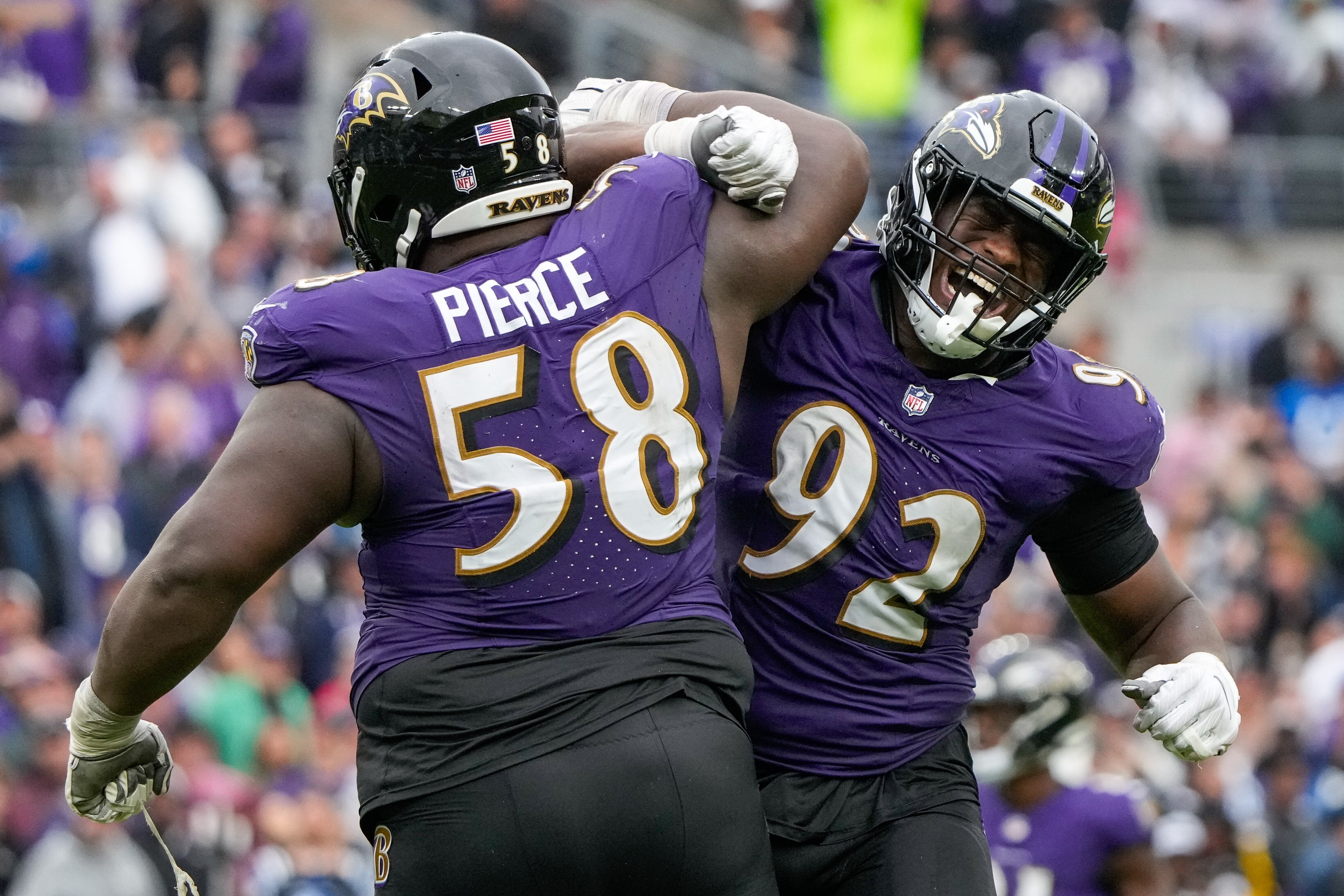 Ravens defensive tackle Justin Madubuike, right, says the celebrating stops after he receives a letter telling him he's been fined. He has paid a total of $38,245 this season.
