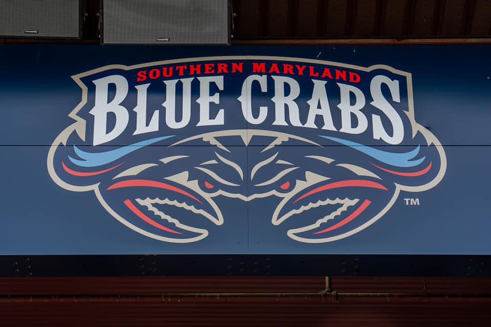 A child was killed and another injured after a wind gust blew a bounce house into the air at a Southern Maryland Blue Crabs baseball game Friday night, local officials said.