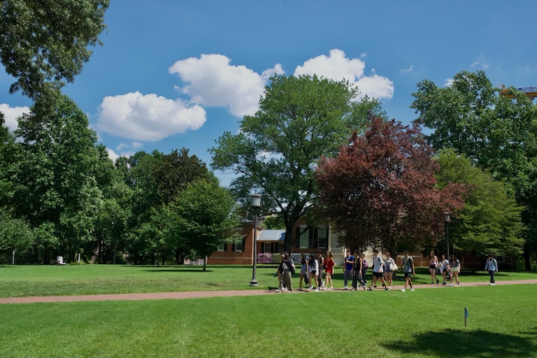 A tour group walks the campus of Johns Hopkins University on July 3, 2025.