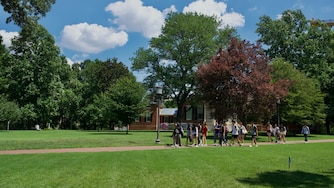 A tour group walks the campus of Johns Hopkins University on July 3, 2025.