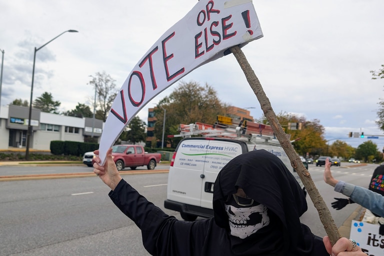 Nancy O'Donnel dressed up as the Grim Reaper for Saturday's No Kings rally near Annapolis.