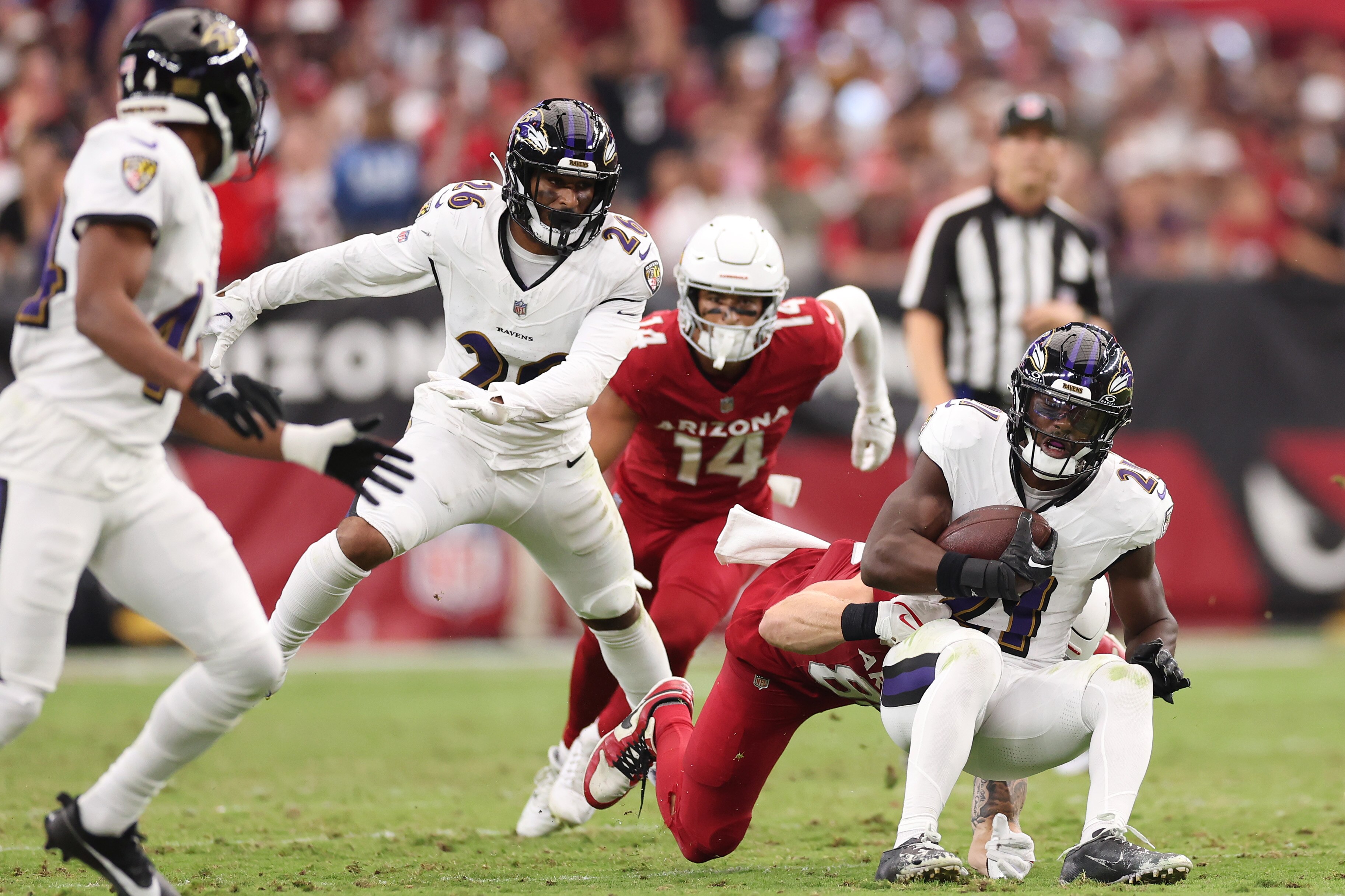 The Ravens' Brandon Stephens comes down with one of the team's two key interceptions during Sunday's 31-24 win over the Arizona Cardinals.