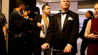 Agents escort people out of the Washington Hilton after an incident at the annual White House Correspondents Association Dinner April 25, 2026 in Washington, DC. The president is making his first appearance at the event which he has shunned from in the past.