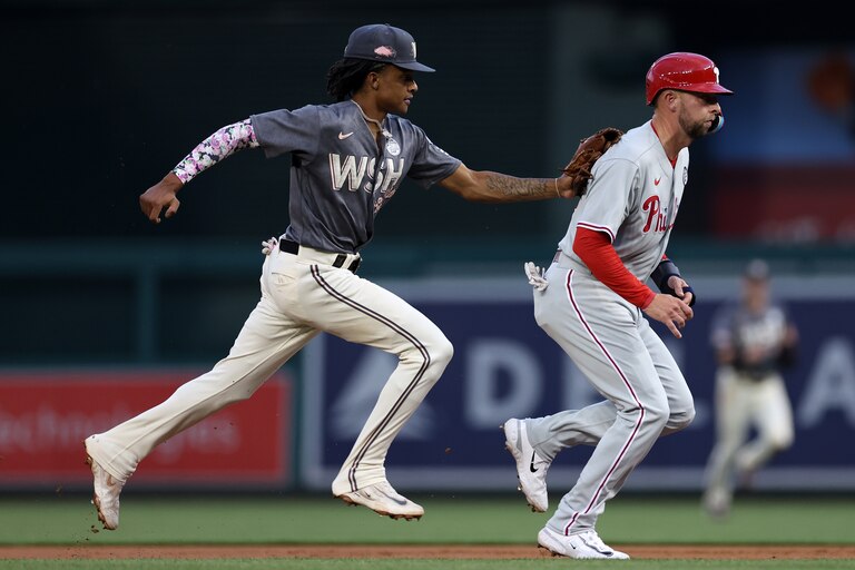 WASHINGTON, DC - JUNE 02: CJ Abrams #5 of the Washington Nationals tags out Drew Ellis #35 of the Philadelphia Phillies in a rundown during the second inning at Nationals Park on June 02, 2023 in Washington, DC.
