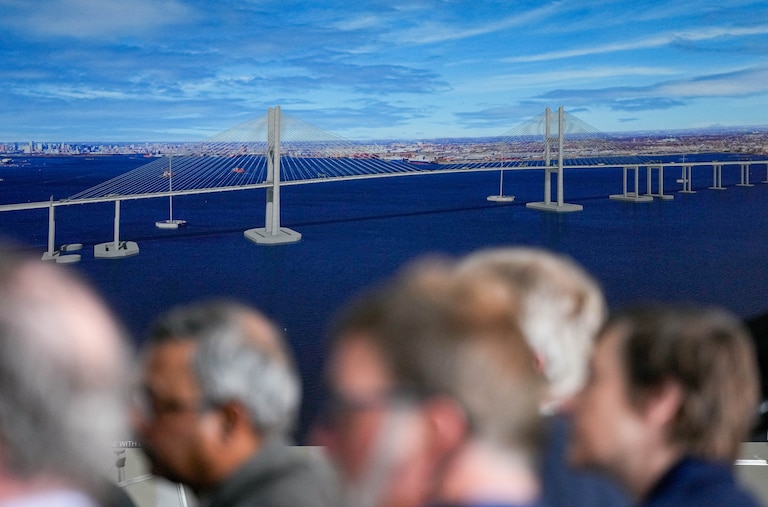 News conference attendees listen to remarks being given about the newly unveiled design for the Francis Scott Key bridge rebuild at Tradepoint Atlantic in Edgemere, Md. on Tuesday, February 4, 2025.