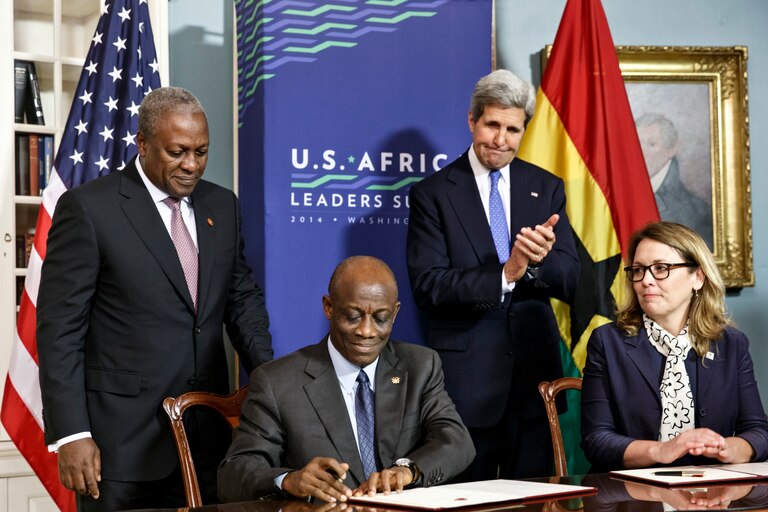 FILE - From left, Ghana's President John Dramani Mahama, Ghana's Finance Minister Seth Terkper, Secretary of State John Kerry, and CEO of the Millennium Challenge Corporation Dana Hyde, participate in the Ghana Compact signing ceremony during the US Africa Leaders Summit at the State Department in Washington on Aug. 5, 2014. A business jet may have experienced problems with its stability before encountering turbulence or some other roughness that caused the death of Hyde, who served in prominent posts in two presidential administrations, officials said Monday, March 6, 2023.