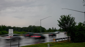 Cars drive on West Nursery Road near BWI during a thunderstorm in the Baltimore, Md. region on Tuesday, July 1, 2025.