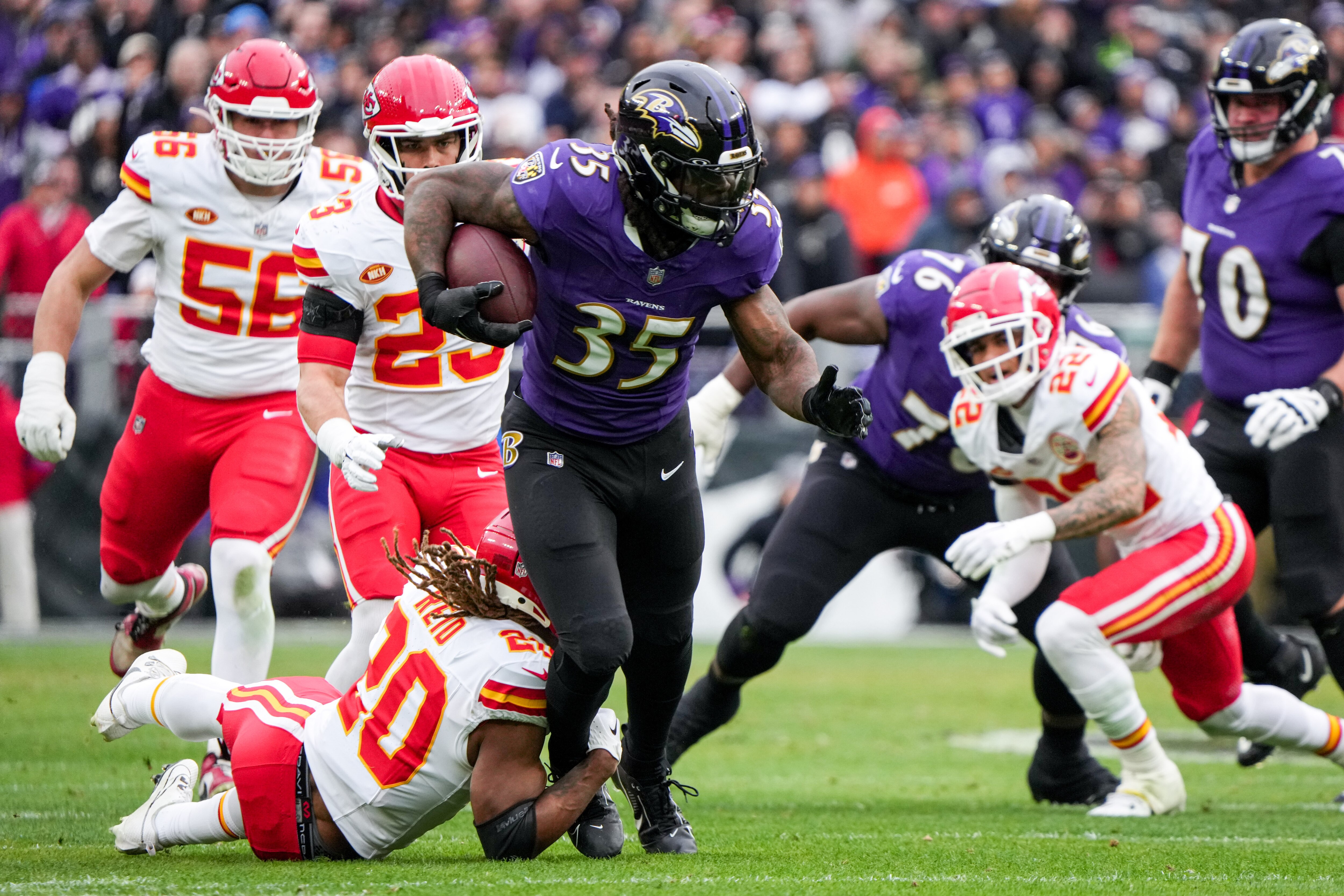 Baltimore Ravens running back Gus Edwards (35) rushes forward with the ball in the first quarter of the AFC Championship game against the Kansas City Chiefs at M&T Bank Stadium on Jan. 28, 2024. The Chiefs beat the Ravens, 17-10, to advance to the Super Bowl.