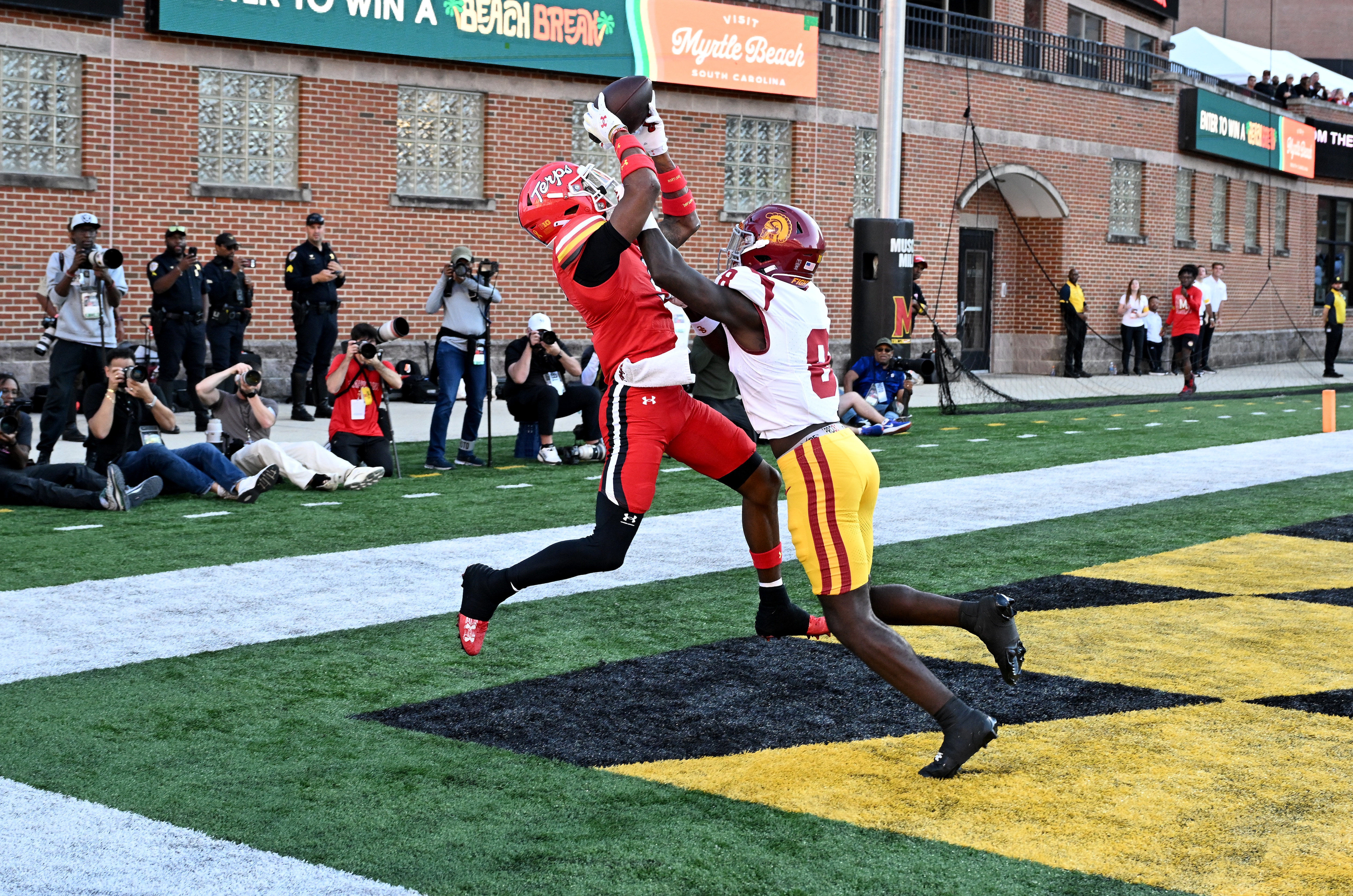 Octavian Smith Jr. of Maryland catches a touchdown in the second quarter against Zion Branch of USC.