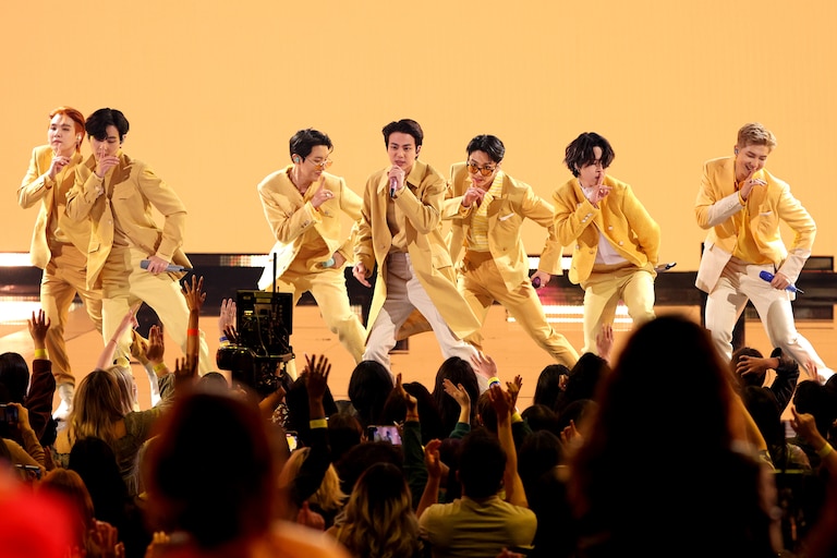 LOS ANGELES, CALIFORNIA - NOVEMBER 21: (L-R) Suga, V, J-Hope, Jin, Jungkook, Jimin, and RM of BTS perform onstage during the 2021 American Music Awards at Microsoft Theater on November 21, 2021 in Los Angeles, California.